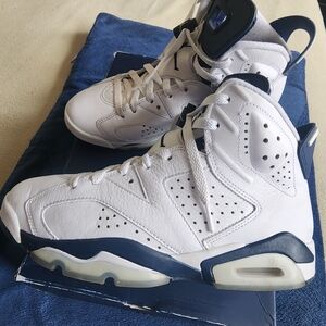 Jordan Retro High-Top Sneakers in White and Blue.